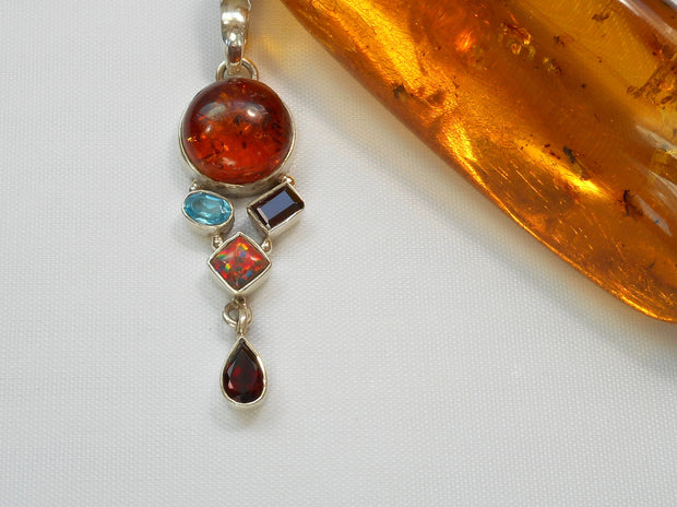 Amber Pendant 8 with Topaz, Garnets and Opal