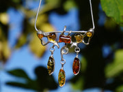 Amber and Sterling Artisan Pendant with Teardrop Dangles